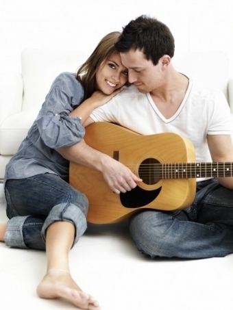 Couple Play Guitar